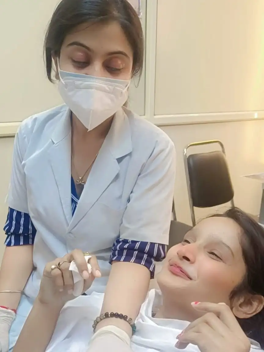 Dr. Surbhi, Expert dentist doing treatment of her patient with care